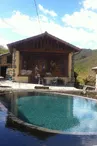 bassin du moulin et façade Nord du gite avec sa fresque